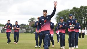 A cricket player takes applause