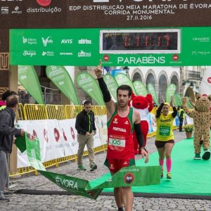 Portugal's Jose Azevedo raises his hand in the air to celebrate as he crosses the finish line