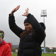 A cross-country runner celebrates winning gold