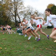 A line of female runners with an intellectual impairment begin a cross-country race