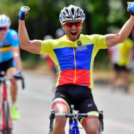 Eric Sarango Tufino clenches his fists as he crosses the finish line at the 2018 World Intellectual Impairment Sport Cycling World Championships