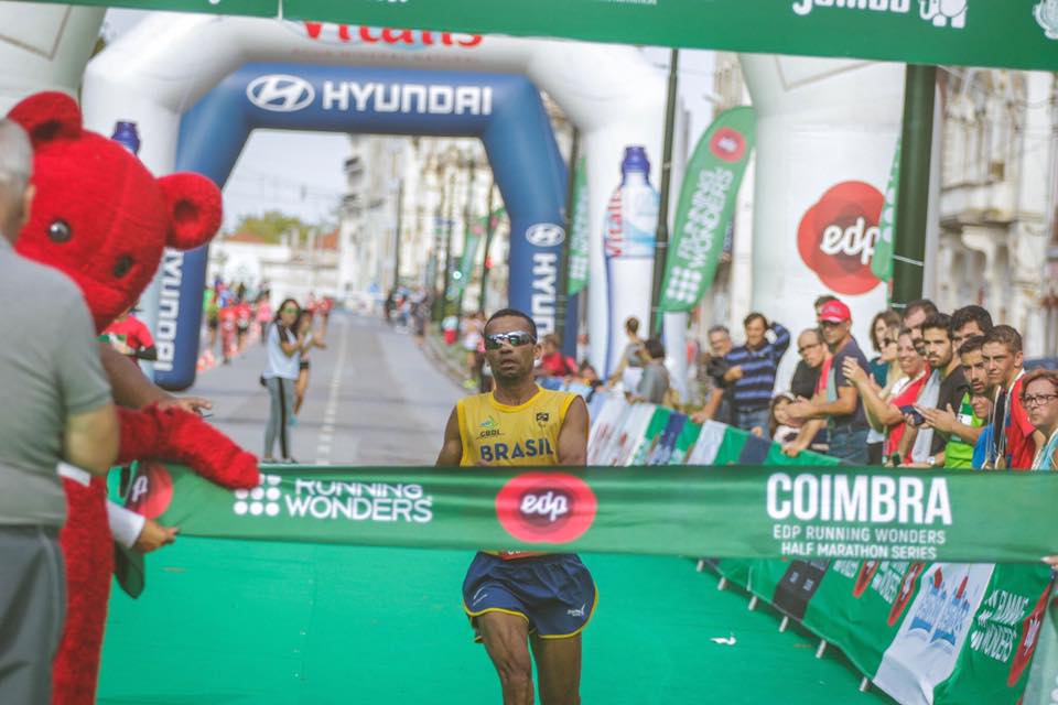 Antonio Silva crosses the finish line in first place at the 2018 World Intellectual Impairment Sport Athletics Half Marathon Championships