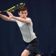 Luke Turnbull is pictured as he is about to hit the ball with his tennis racket