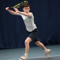 Luke Turnbull is pictured as he is about to strike the ball with his tennis racket