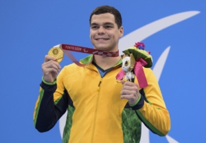 Gabriel Bandeira holds Gold medal for 100 meter Butterfly at Tokyo 2020 Paralympic Games.