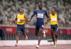 France's Charles-Antoine Kouakoa crosses the finish line to win Gold at the 400 meter