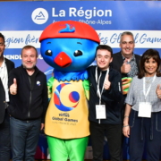 Group of people representing Virtus Global Games and La Region surround Lorri the Lorikeet mascot